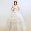 White strapless bustier korean princess wedding dress with beaded bodice and layered tulle wedding skirt