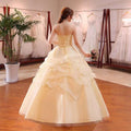 Strapless champagne-colored bustier korean princess beaded tulle wedding dress with corseted back and layered skirt