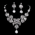 Silver-toned floral butterfly necklace earring set with sparkling blue crystal and water drop necklace design