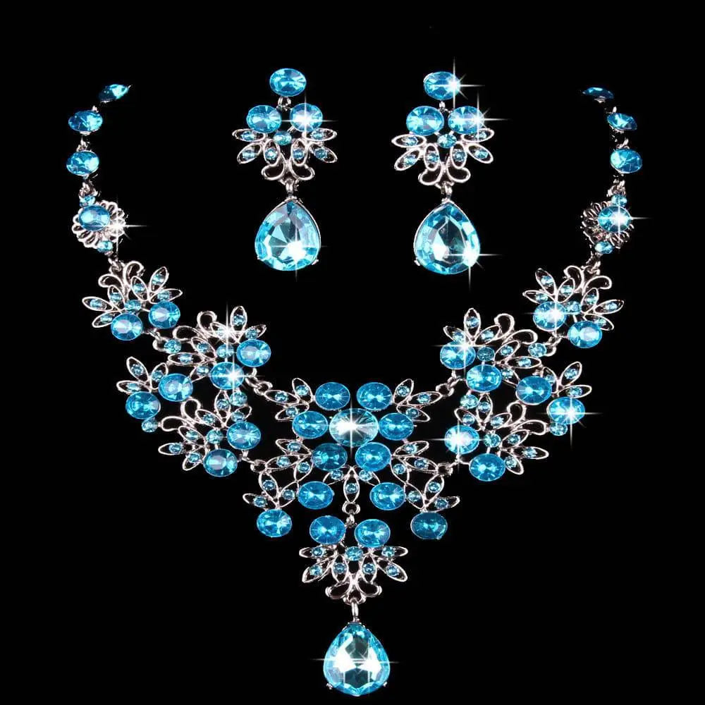 Silver-toned floral butterfly necklace earring set with sparkling blue crystal and water drop necklace design