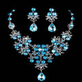 A butterfly big water drop crystal necklace earring set with blue crystal teardrops and silver-toned floral designs