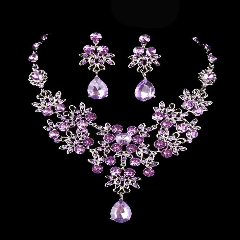 Elegant purple crystal butterfly necklace earring set with silver-toned floral design and teardrop water drop necklace