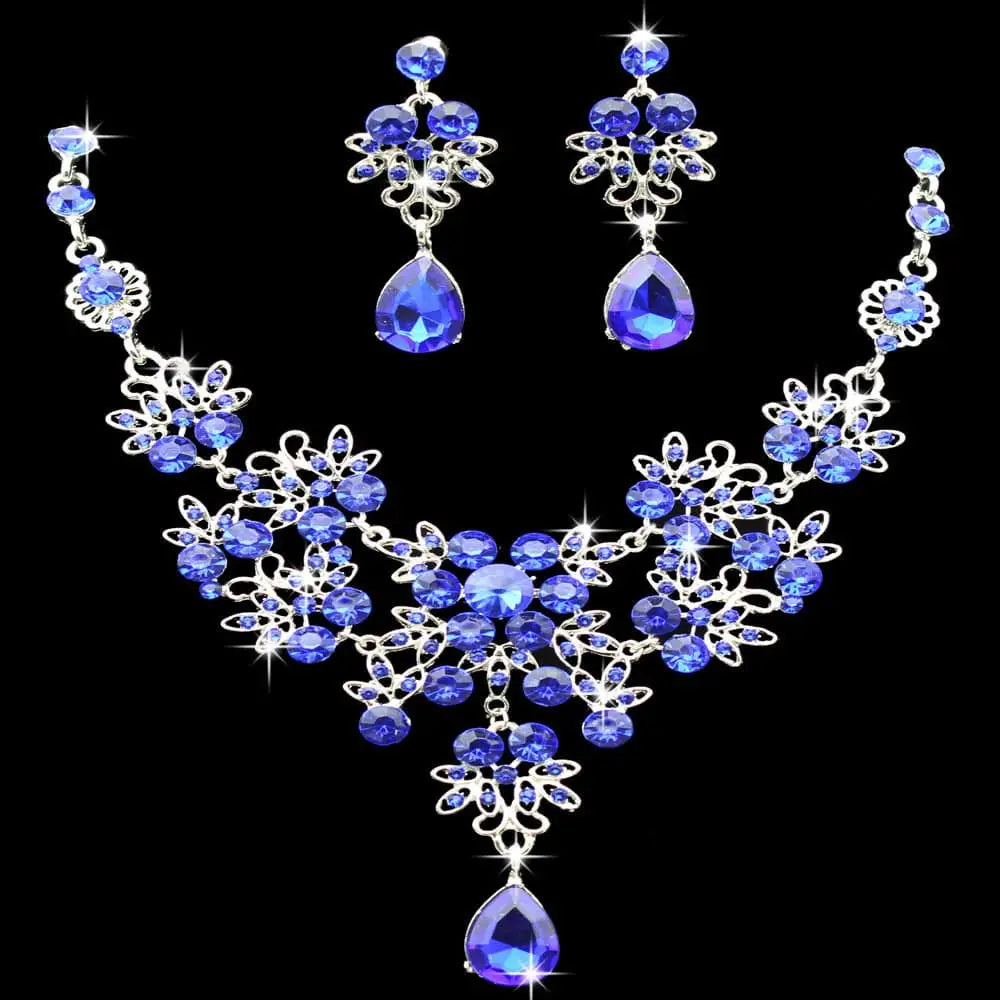 Elegant royal blue crystal water drop necklace and matching earrings set with silver-toned floral filigree design