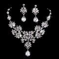 Silver-toned floral butterfly necklace and earrings set with sparkling blue crystal water drop accents