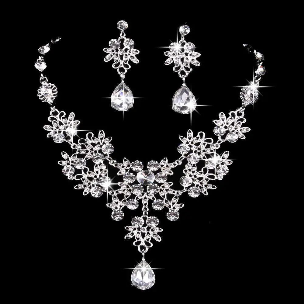 Silver-toned floral butterfly necklace and earrings set with sparkling blue crystal water drop accents