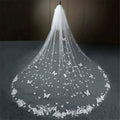 A delicate white butterfly lace sky veil bridal wedding dress with butterfly appliqués and an intricate floral border