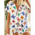 White short sleeve homewear suit with vibrant butterfly print in blue pink green and orange for comfortable wear