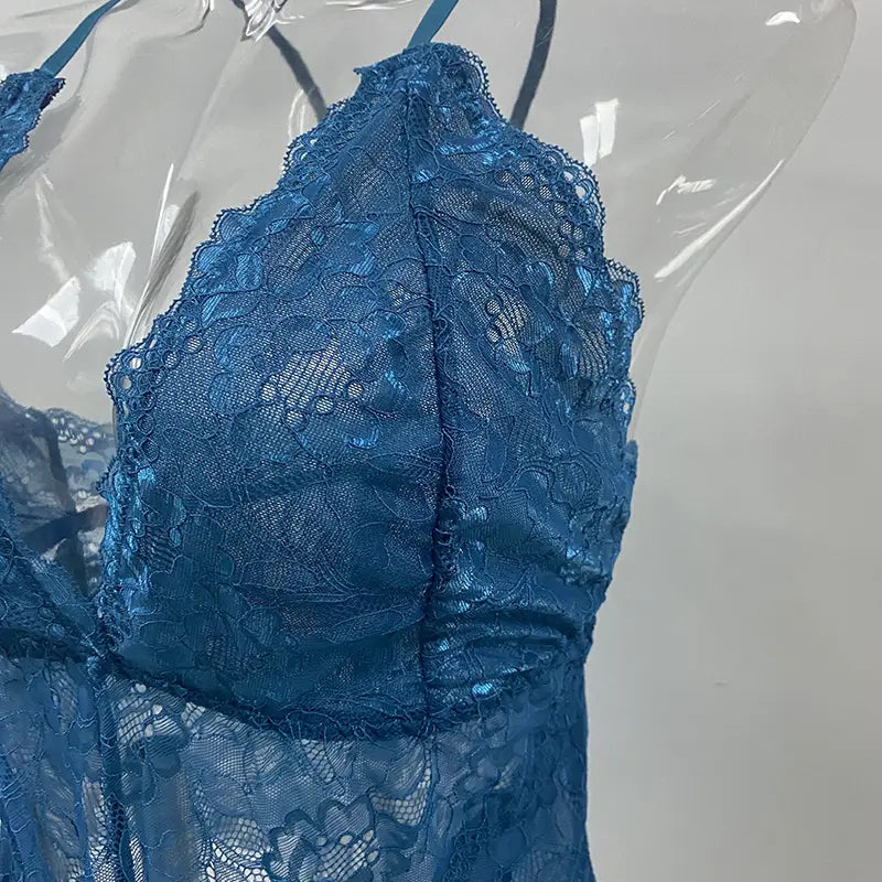 a delicate blue lace bra with intricate floral patterns and thin straps as part of a sleeveless halter plus size lace bodysuit