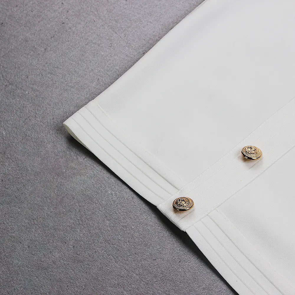 white blouse with gold-toned ornate buttons paired with a chest scheming hip short skirt in white fabric