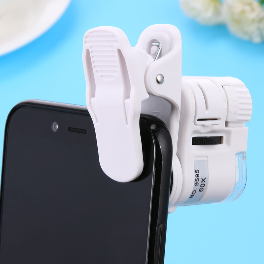 white plastic clip-on magnifying lens with led light for smartphones designed as a digital microscope camera accessory