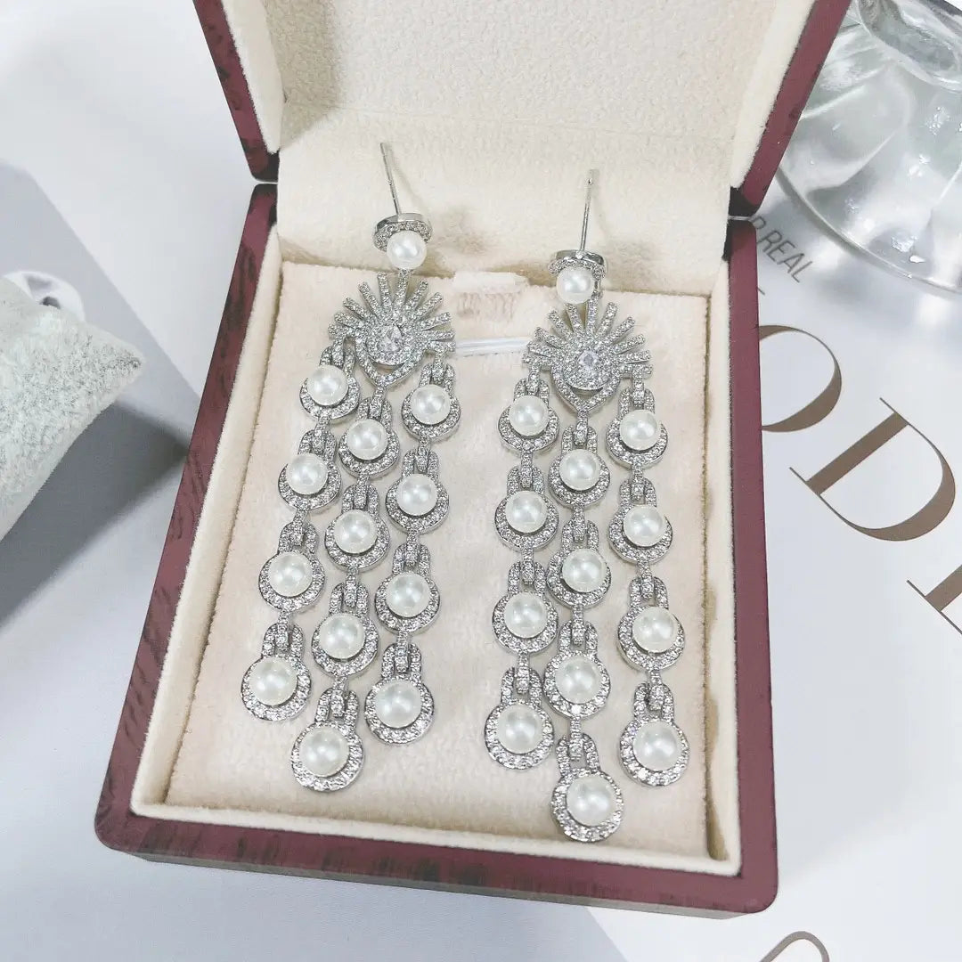 Elegant silver pearl micro inlay zircon style beaded fringe earrings featuring cascading rows of round white pearls and sparkling rhinestones.