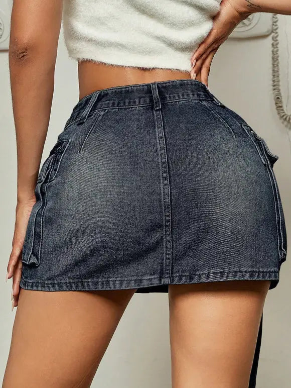 dark blue denim skirt featuring cargo pockets in a short skirt design with a long tether detail