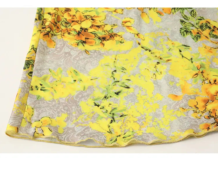 a flowing yellow floral satin cross lace nightdress featuring an orange floral print scarf on a subtle gray lace background