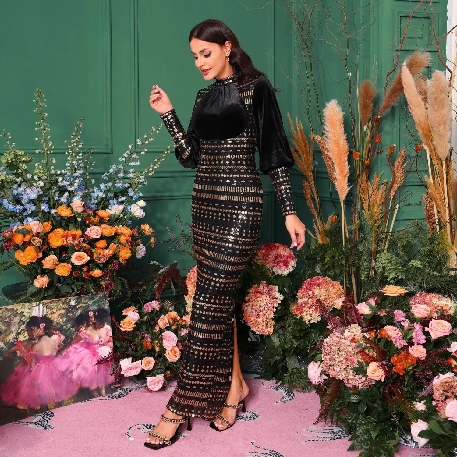 Black sequined and velvet long sleeve round neck maxi dress with a high neckline and side slit.