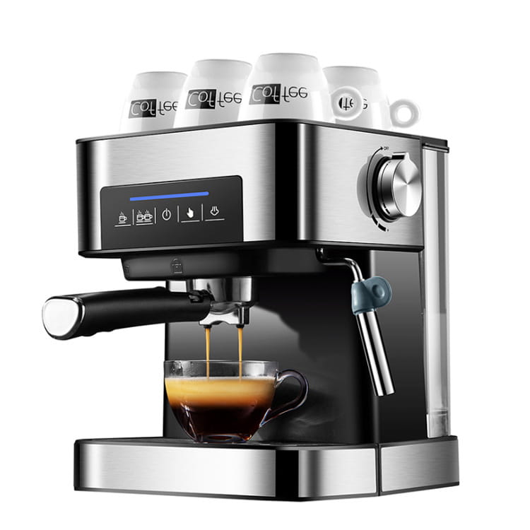 Stainless steel espresso machine with black accents and a digital display brewing coffee into a glass cup featuring a steam milk frother for steam milk functionality.