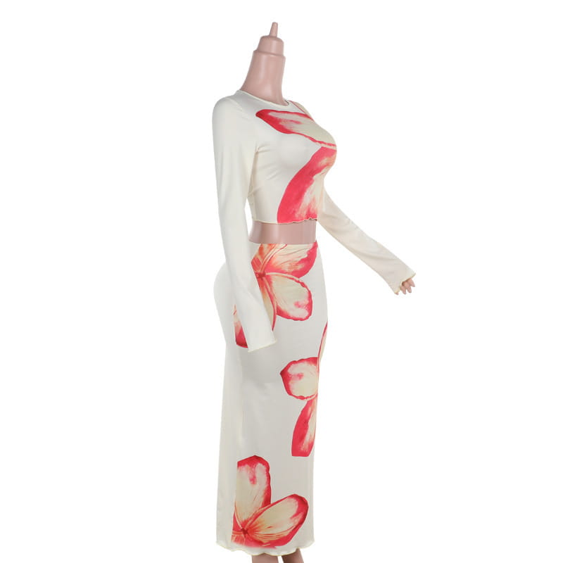 a white long-sleeved elegant slim print two-piece set featuring a cropped top with a slim print round neck and a high-waisted skirt adorned with large pink floral prints