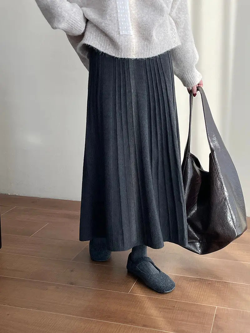 dark gray midi skirt with a korean elastic waist and pleated design made from soft textured elastic waist knitted fabric