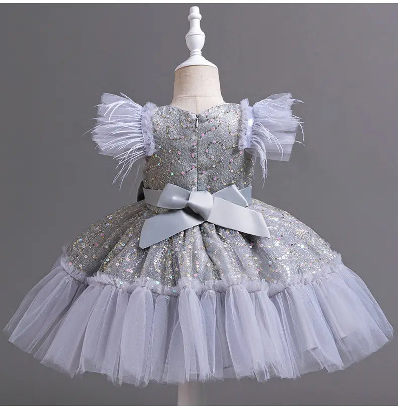Silver sequined wedding dress tulle features feathered puff sleeves and a layered dress tulle skirt with a matching satin bow at the waist perfect for tulle skirt summer events.