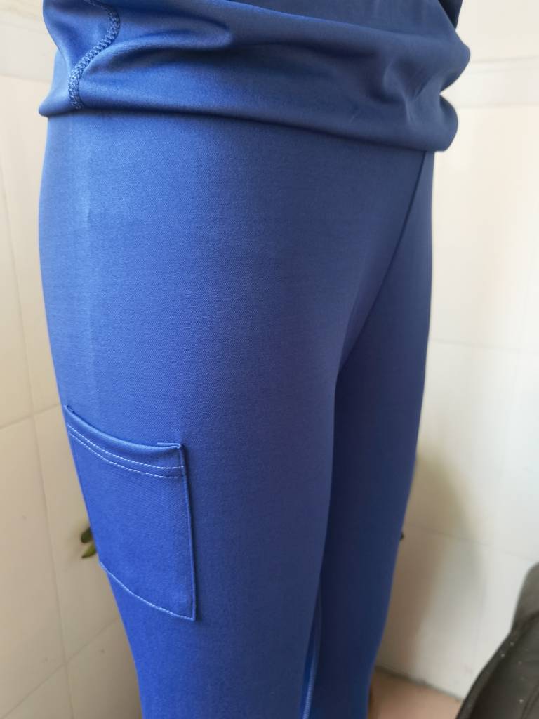 blue women tennis skirted leggings with ribbed waistband and side pocket designed for comfortable performance and storage in skirted leggings pockets.
