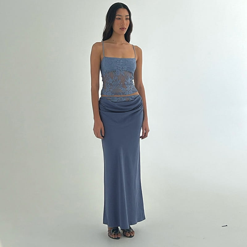 a soft blue lace backless tube top with delicate floral embroidery and sling stitching ruffle paired with a matching satin stitching ruffle hip skirt flowing gracefully to the floor