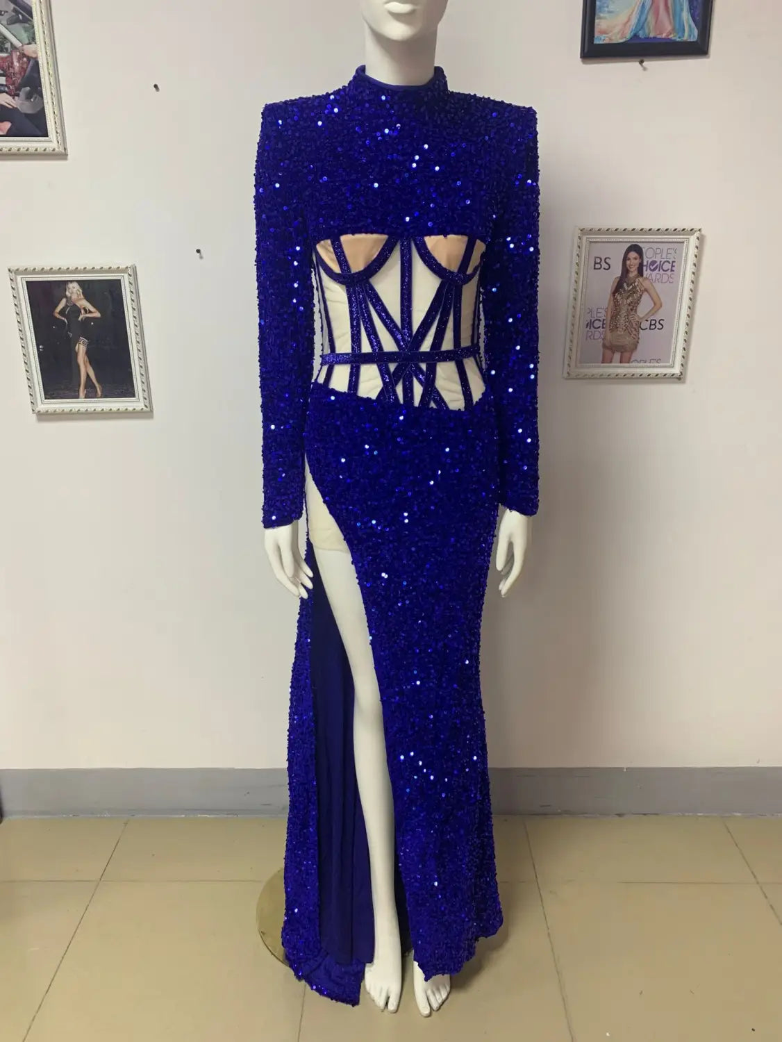 a dazzling royal blue siren ji sequin gown featuring a high neckline, long sleeves, and a high slit for elegant evening wear