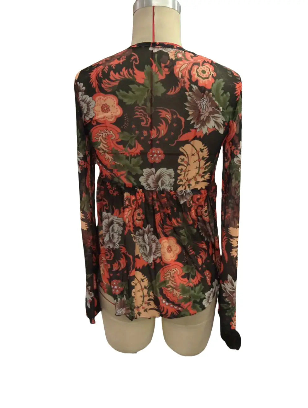 a mesh printed floral romper featuring a knotted flare sleeve design with a vibrant red orange and green pattern on a dark background