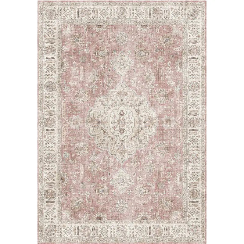 a vintage-style burgundy ornate short pile area rug featuring a faded dusty rose center with intricate cream-colored floral patterns and detailed border designs, ideal for luxury women’s fashion settings including plus size dresses and bikinis displays.