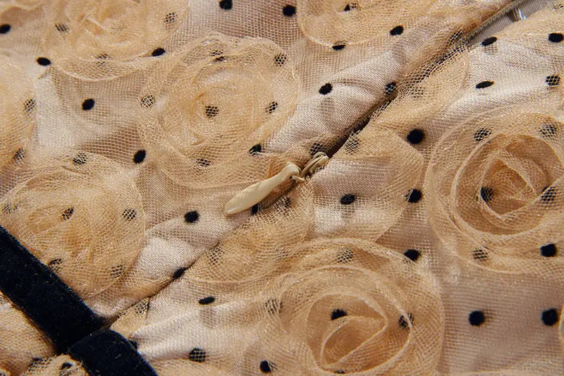 Beige lace slim drawstring dress with black polka dots and intricate rose appliqués in a blush pink lace slim drawstring dress style.