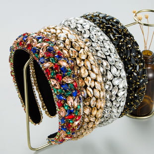 a collection of five ornate baroque vintage court style headbands featuring crystal embellishments in vibrant and metallic hues