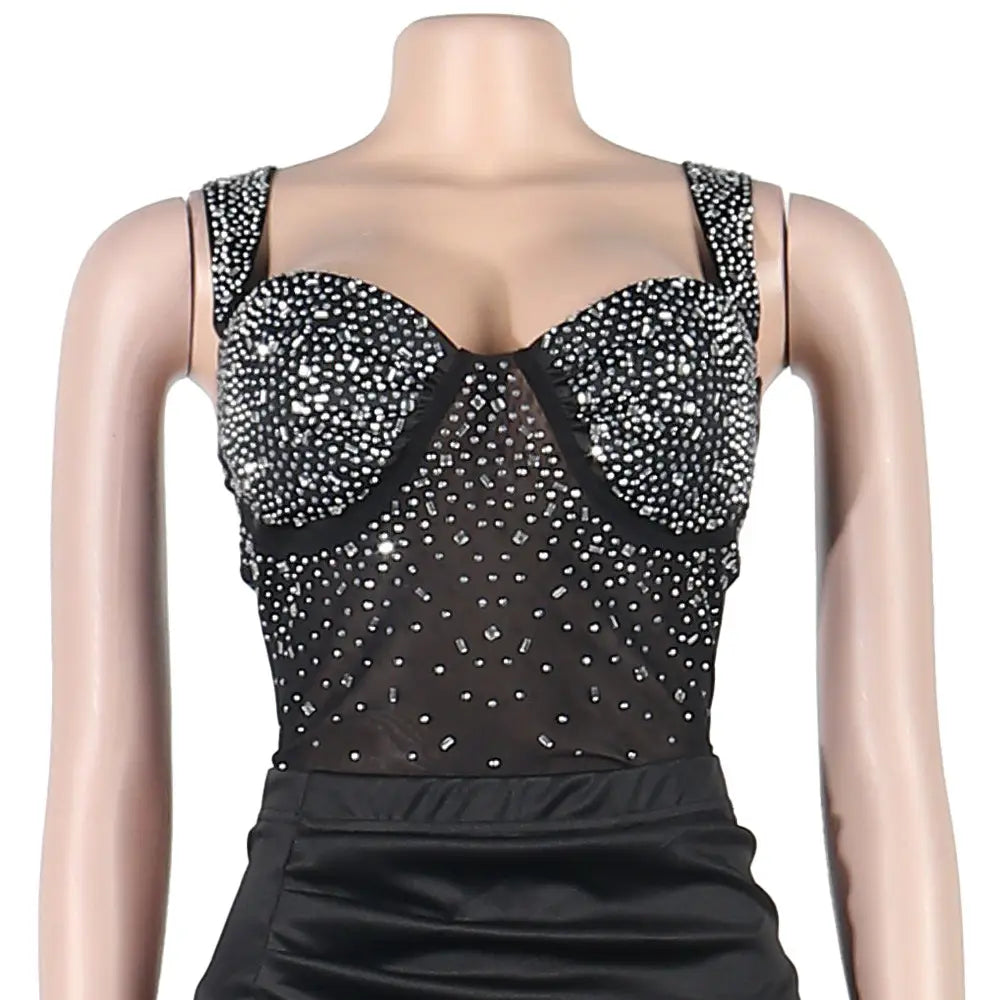 Black sheer bodysuit top with structured corset design adorned with sparkling silver rhinestones in the rhinestone sling backless two-piece set two colors.