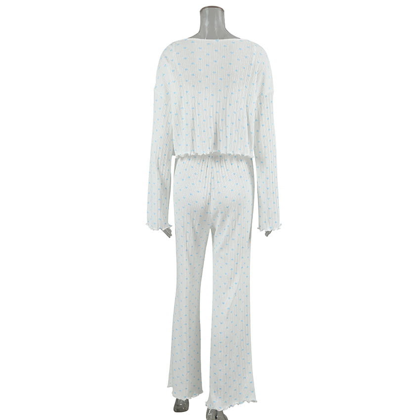 white pleated jumpsuit with light blue polka dots and frayed hem details from knitted heart printing ribbed loungewear set, combining heart printing comfortable style with elegant design.