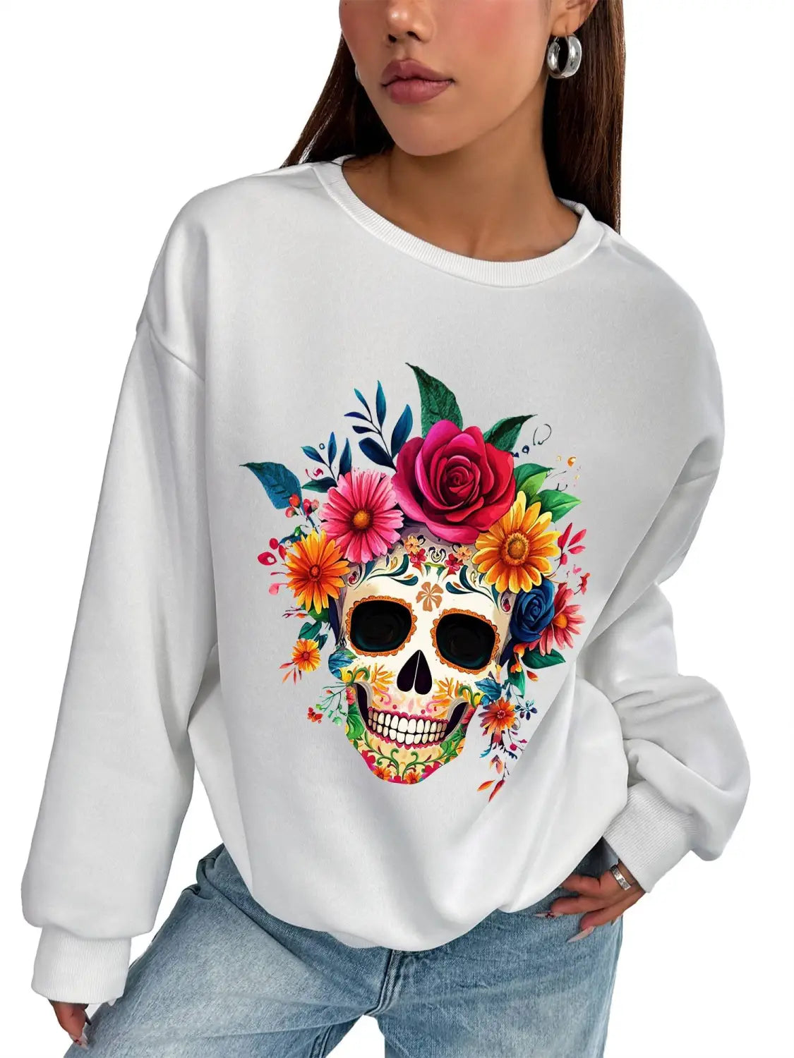 White basic long sleeve crew neck sweatshirt featuring a vibrant colorful floral skull design with roses and blossoms in shades of pink yellow orange blue and green for daily wear.