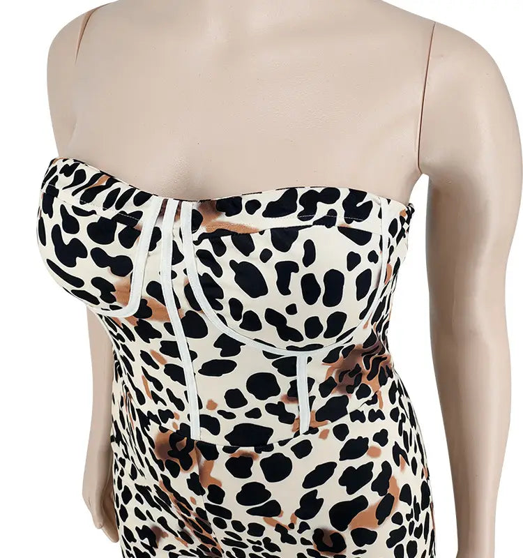A strapless corset-style leopard print jumpsuit plus size women’s garment in bold black white and tan with matching drawstring detailing.