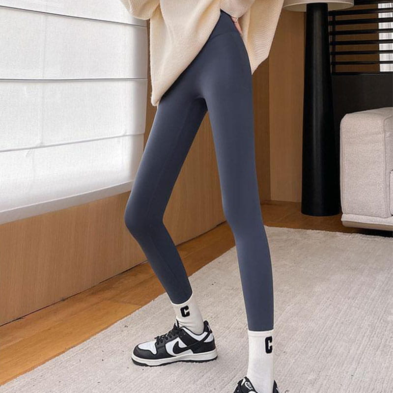 dark gray fleece thickened winter shark pants high waist leggings made of smooth stretchy material designed for warmth and comfort.