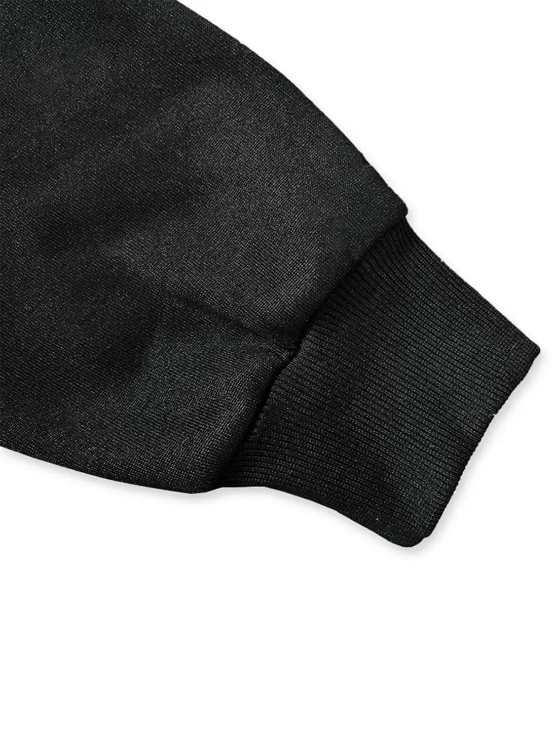 black ribbed knit cuff on the sleeve of a black leopard number 14 crew neck sweatshirt made from soft fabric