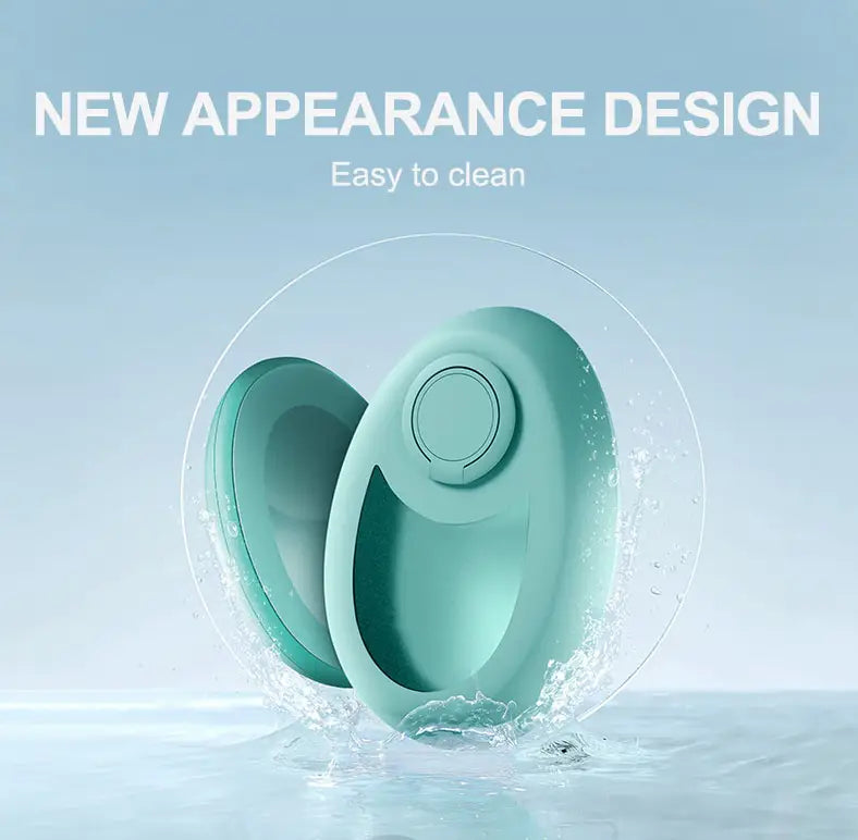 a sleek mint-green silicone egg-shaped teal nano glass crystal hair eraser removal tool with a circular button on its top surface designed for effective hair removal and crystal hair care