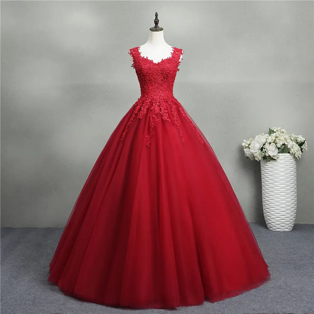 A vibrant red bride princess dream ball gown featuring intricate lace detailing on the bodice and a flowing tulle skirt perfect for spring tutu tutu occasions.
