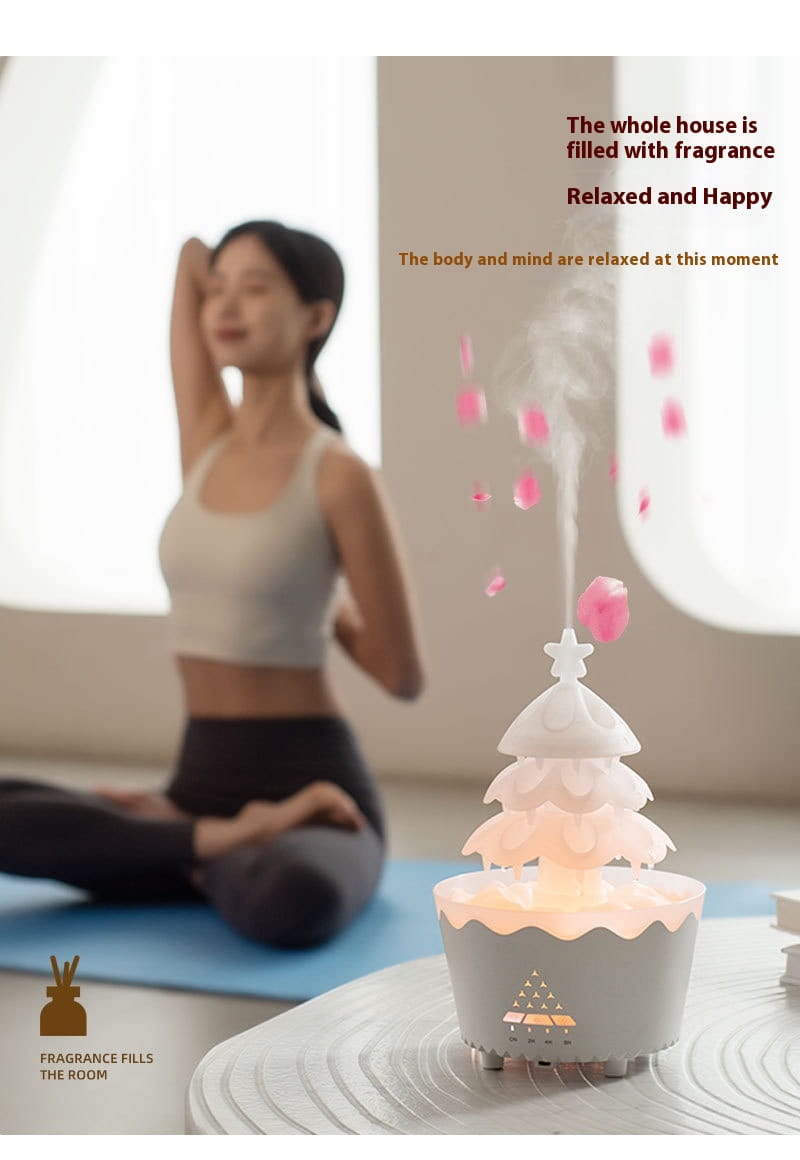 white ceramic christmas tree essential oil aroma diffuser humidifier with soft glowing light and pink floral accents designed as a decorative oil aroma diffuser