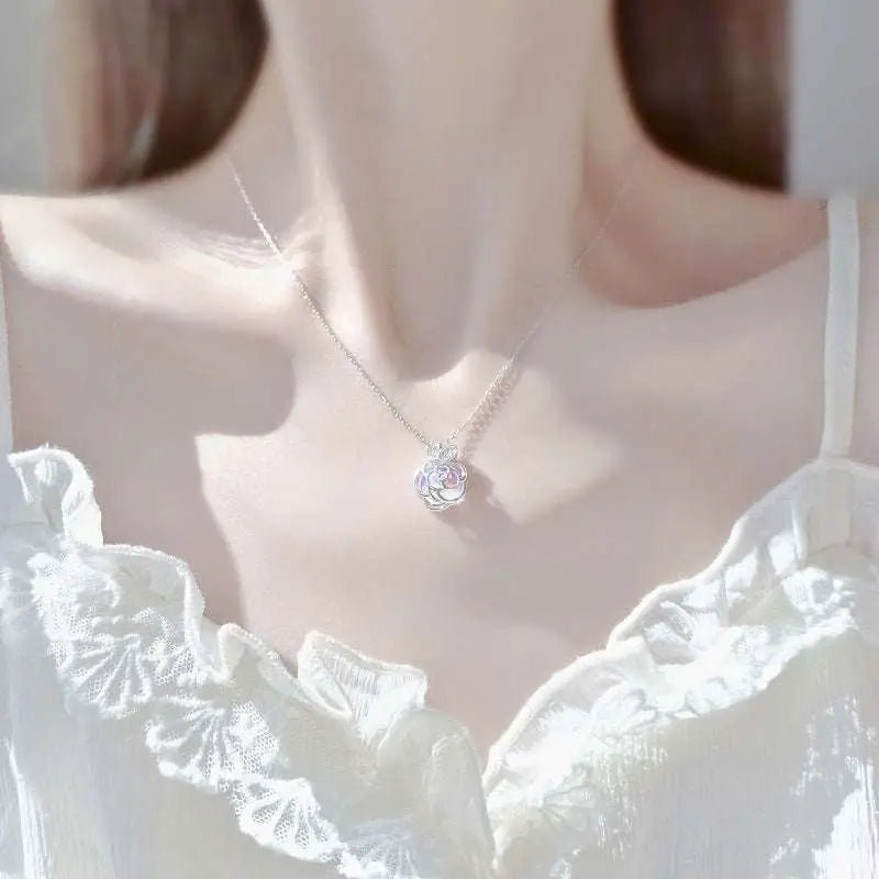 Camellia advanced design silver rose necklace with a delicate silver rose pendant and sparkling faceted center