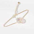 Gold-toned chain bracelet with delicate iridescent rose pendant crystal accents camellia advanced design silver rose necklace