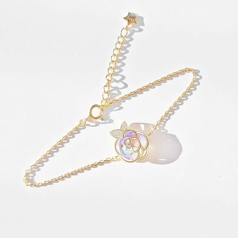 Gold-toned chain bracelet with delicate iridescent rose pendant crystal accents camellia advanced design silver rose necklace