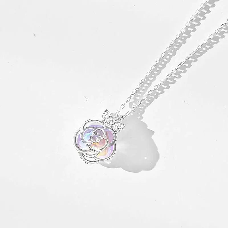 Camellia advanced design silver rose necklace with a delicate silver rose pendant featuring iridescent center and leaf accents