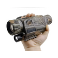 Camouflage-patterned night vision monocular with a black front lens and side-mounted flashlight.
