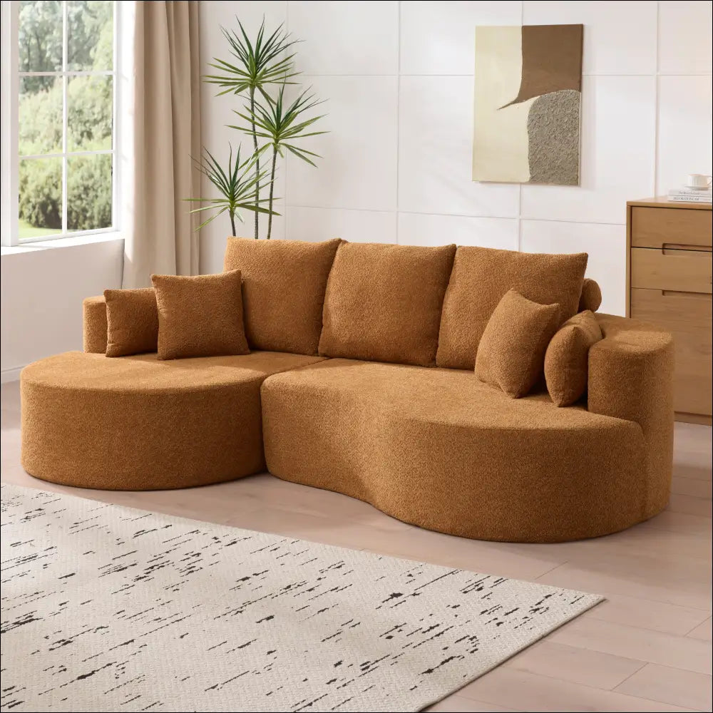 Caramel fabric cloud curved sectional sofa with warm plush fabric and matching throw pillows for cozy seating