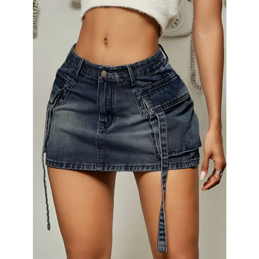 Dark blue denim skirt with cargo pockets side pockets and a matching tie belt in a long denim skirt style