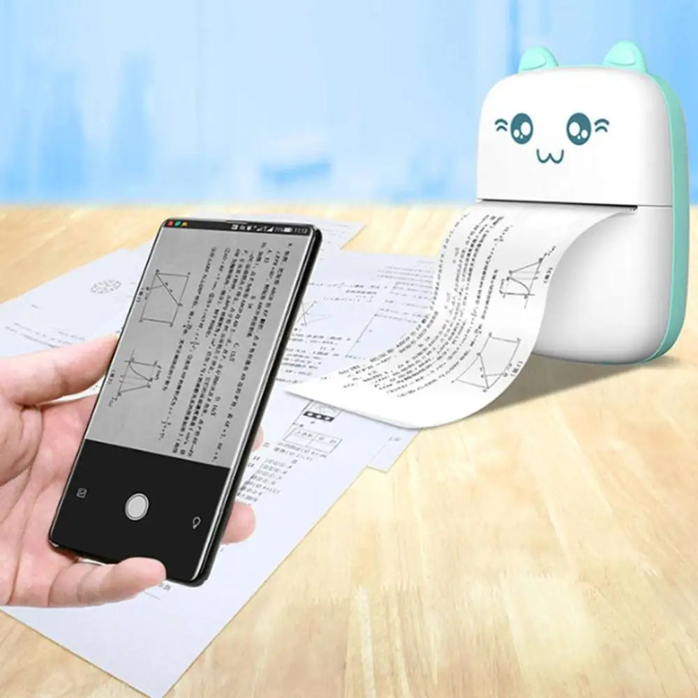 White and light green cat ear mini portable bluetooth labeler printing a document from a smartphone