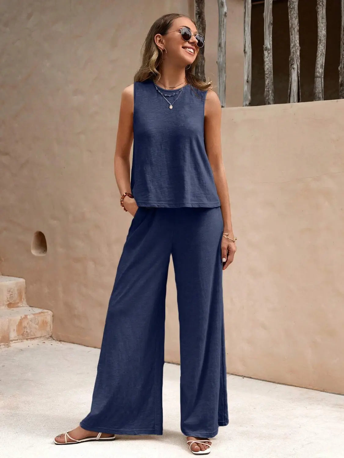 navy blue sleeveless top with relaxed fit and soft fabric paired with black casual loose pants in a casual loose pants set