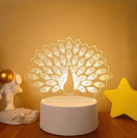 white acrylic peacock shaped 3d led night light with intricate feather detailing featuring colorful touch remote control for adjustable lighting.