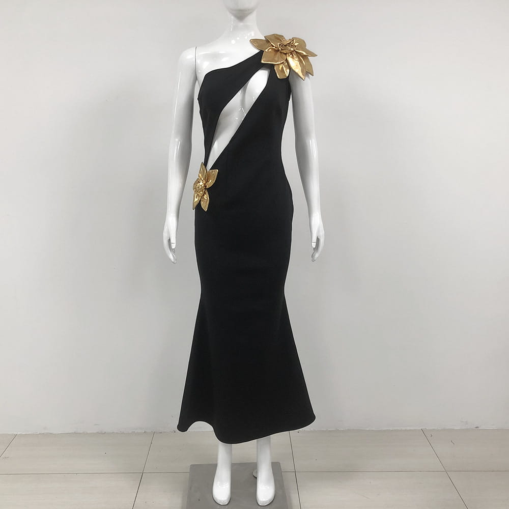 Black satin bandage golden flower maxi dress featuring a one-shoulder design and gold metallic floral embellishments on a black mermaid silhouette.
