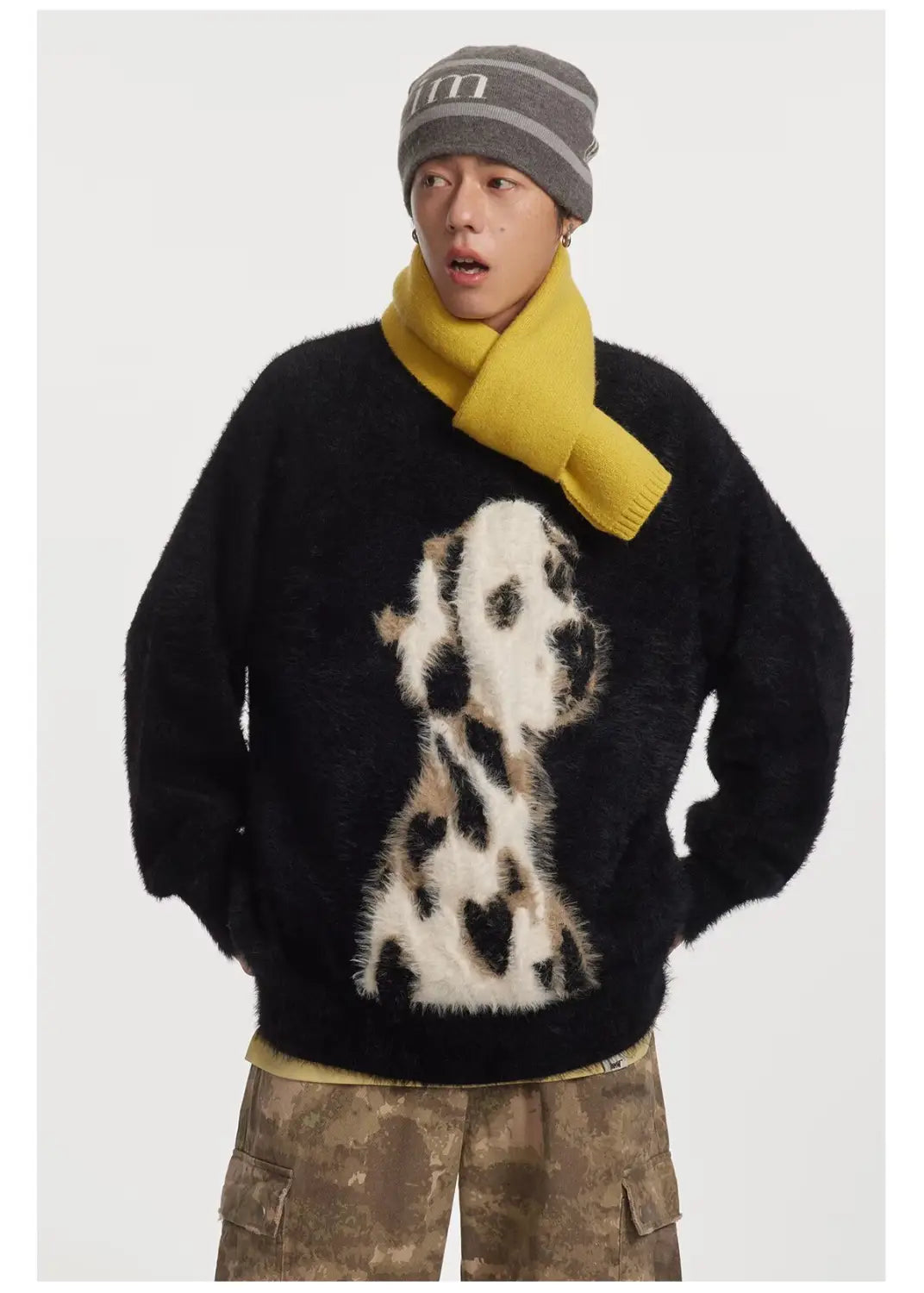 black fuzzy sweater featuring a prominent white and black dalmatian dog graphic on the front made from jacquard mink cashmere knitted fabric
